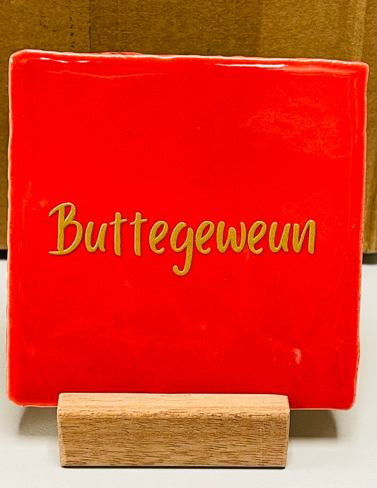 Quote tegel Buttegeweun rood.