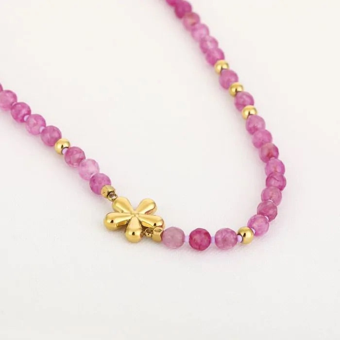 Paarse ketting met gouden bloem